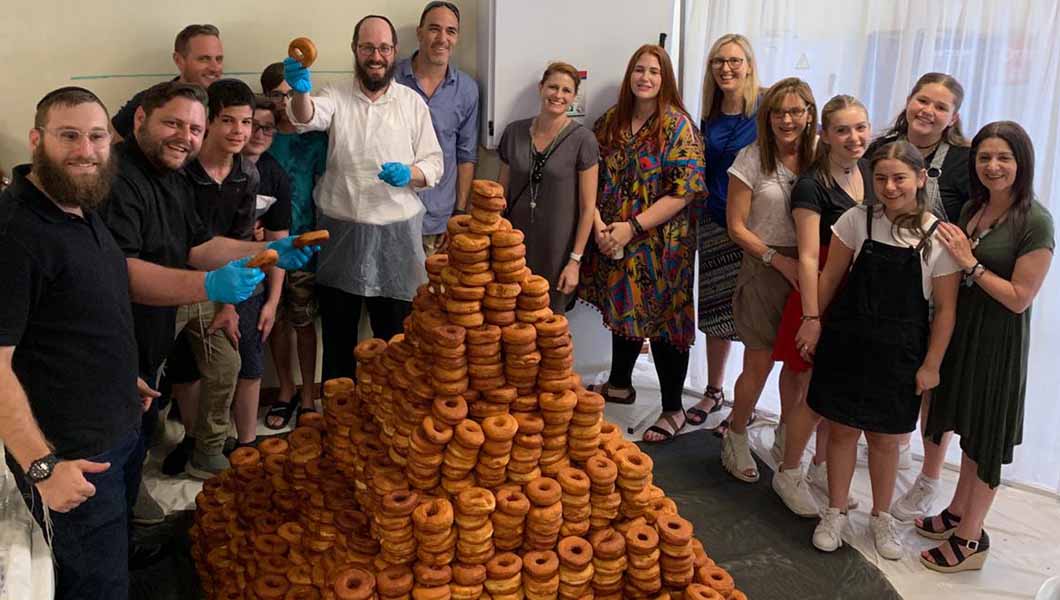 Sweet taste of success as more than 3,000 doughnuts are stacked to form record-breaking tower | Guinness World Records